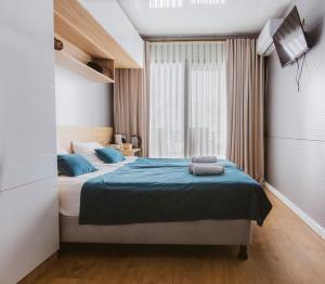 Postel nebo postele na pokoji v ubytování Landscapes Hotel Kazbegi