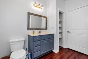 a bathroom with a blue sink and a mirror at Summer Bliss,Blocks to the Beach-Midtown Galveston in Galveston +45 photos