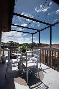 A balcony or terrace at Tranquil Surf Beach apartment.