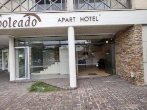 a store front of a art hotel with a pole at Soleado Apart Hotel in San Rafael