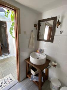 a bathroom with a sink and a mirror at Marthas Traditional House in Symi