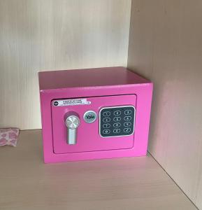 a pink toy microwave oven sitting on top of a table at Oasi Verde appartamento in Montesilvano