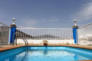 a swimming pool on the roof of a building at Casa Aurora in Carcabuey