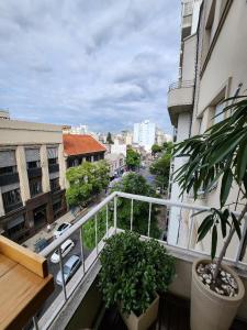 an apartment balcony with a view of a city at Confortable Habitacion en casa particular con baño compartido in Buenos Aires