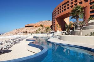 a hotel with a swimming pool next to a building at The Westin Los Cabos Resort Villas - Baja Point in El Bedito