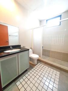 a bathroom with a toilet and a shower and a sink at [HERITAGE 4] HOMESTAY Studio 4Pax, FREE WIFI in Seri Kembangan