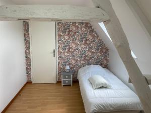 En eller flere senge i et værelse på Gîte à 10mns du Treport et Criel sur Mer