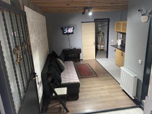 A television and/or entertainment centre at Mara Suite Taxim