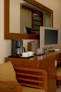 a desk with a computer and a monitor on it at Grand Riviera Princess - All Inclusive in Playa del Carmen