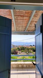 a view from a door of a kitchen with a view at Nikolas Villa in Ambelas