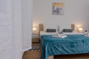 Posteľ alebo postele v izbe v ubytovaní Blue Mile Apartman Split