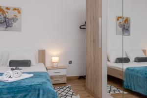 Posteľ alebo postele v izbe v ubytovaní Blue Mile Apartman Split