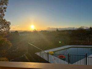 a view of the sunset from a house with a swimming pool at Heated Pool and Jacuzzi, Scenic Mountain View, Lux and Cozy, in Cottonwood
