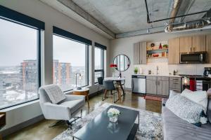 a living room with a couch and a table at Sable 87 - One Bedroom in Minneapolis