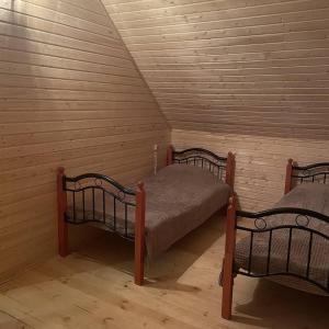 a room with two beds in a attic at Yeghevni Rest House in Jermuk
