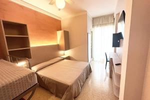 Postel nebo postele na pokoji v ubytování Hotel Everest + 37 fotografií