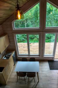 a kitchen with a table and two chairs in a room at Villa Pillapalu in Pillapalu