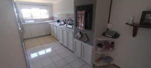 a kitchen with a sink and a counter top at 74 On Ridge in Bazley Beach