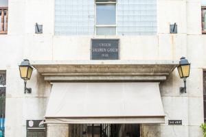 a building with a sign over a door at Apartamento Ganem 505a in Cartagena de Indias