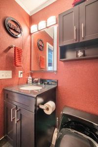 a bathroom with a sink and a mirror at Contemporary Paradise w/ Private Bathroom in Nashville