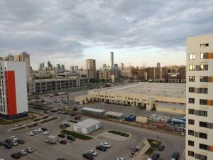 an aerial view of a parking lot in a city at 1-но комнатная квартира в центре Астаны ЖК Sezim Qala 4 in Astana