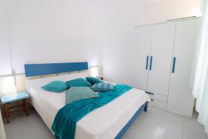 Postel nebo postele na pokoji v ubytování Casa vacanze Lucrezia a Otranto 4 posti