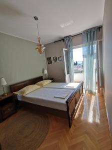 Postel nebo postele na pokoji v ubytování Apartmani Meri