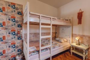 En eller flere senger på et rom på Q PODGORICA Beds,Rooms and more