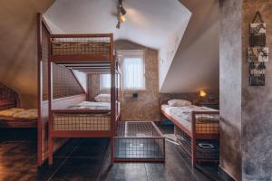 En eller flere senger på et rom på Q PODGORICA Beds,Rooms and more