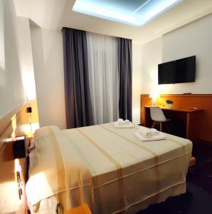 Postel nebo postele na pokoji v ubytování Hotel TEA - Praia a Mare