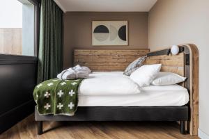 Letto o letti in una camera di Hotel Valaisia Crans Montana, a Faern Collection Resort