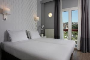 Cama ou camas em um quarto em Abc Hotel