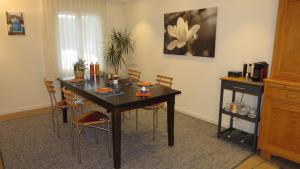 a dining room with a table and chairs at Dorf-Schmiede - Bed und Breakfast in Müllheim