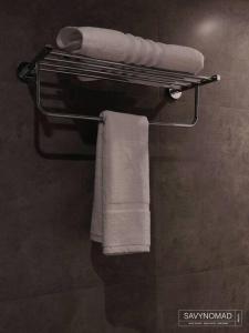 a towel rack with towels on it in a bathroom at Crew 2 Savynomad Harbour Residences wow Views in Cospicua