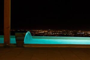 a view of a city at night at Barefoot Summer House in Klis