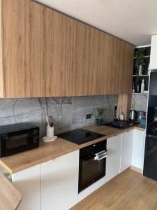 Η κουζίνα ή μικρή κουζίνα στο Uroczy apartament blisko Zalewu-Lublin +4 φωτογραφίες