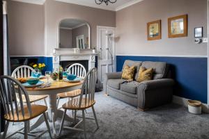 a living room with a table and a couch at The Elderton, Newbiggin By The Sea, Northumberland in Newbiggin-by-the-Sea