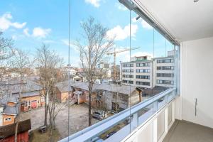 an apartment balcony with a view of a city at Studiohuoneisto Ainonkatu AC, WiFi, balcony in Lappeenranta