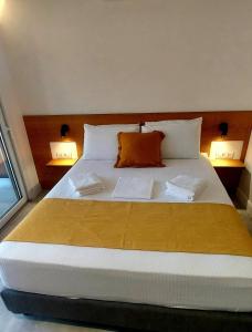 Кровать или кровати в номере Amimaya Apartments