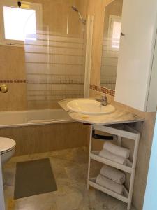 a bathroom with a sink and a shower at Los Hidalgos Golf 7 in Manilva