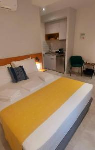 Кровать или кровати в номере Amimaya Apartments