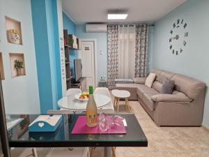 a living room with a couch and a table at apartamento Adrian y Vanessa VFT/JA/00086 in Baeza