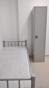 Postel nebo postele na pokoji v ubytování الامارات العربيه المتحده - عجمان