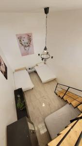 an overhead view of a living room with a chandelier at Luxury en-suite Double. Beach-house with Sea Views in Mellieħa