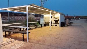a bus stop with a bench under a canopy at Era 124 in Zafra de Záncara