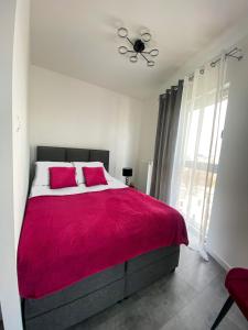 Posteľ alebo postele v izbe v ubytovaní Apartament Manhattan City Center + 10 fotografií