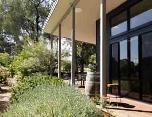 a house with large windows and a patio at The Dairy . Margaret River in Margaret River Town