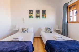Postel nebo postele na pokoji v ubytování Villa de Pino + 37 fotografií