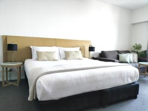 Katil atau katil-katil dalam bilik di Darwin Harbour Suite