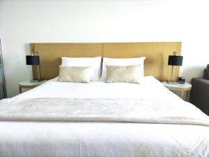Katil atau katil-katil dalam bilik di Darwin Harbour Suite